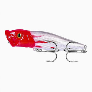 Isca Artificial Popper Pro X Cabeça Vermelha mostrada do lado esquerdo, com todas as suas cores e sua garateia em foco