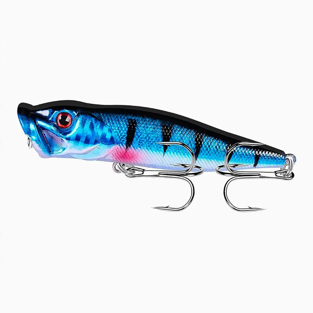 Isca Artificial Popper Pro X Azul Neon mostrada do lado esquerdo, com todas as suas cores e sua garateia em foco