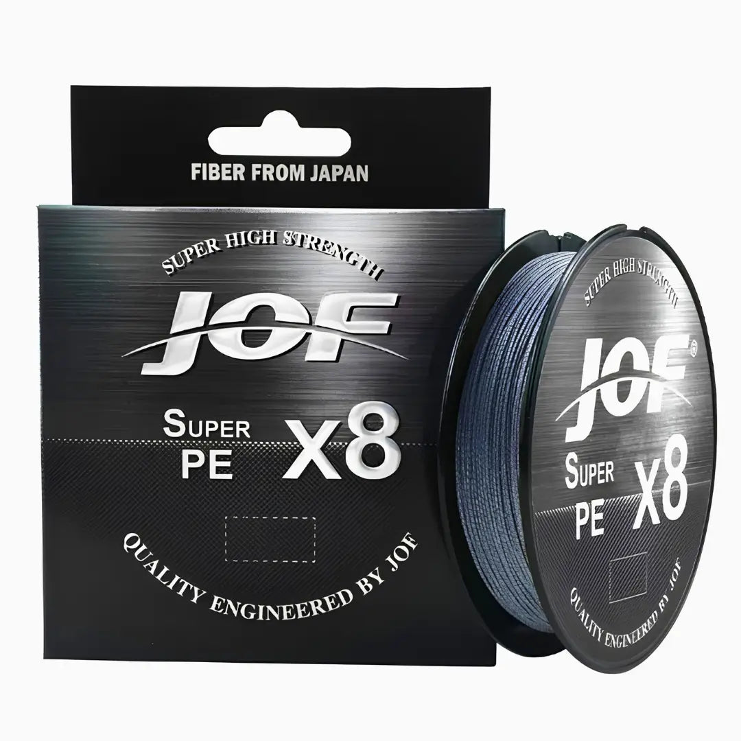 O Carretel da Linha Multifilamento JOF Pure na cor cinza em foco, com sua caixa ao lado