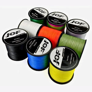 9 carreteis da Linha Multifilamento Jof Super Braid em várias cores em destaque, alguns estão em pé e outros deitado